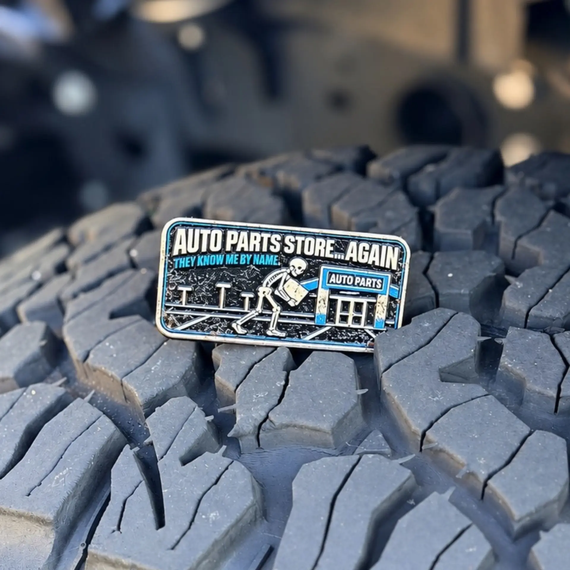 Auto Parts Store...Again trail badge photographed on a tire