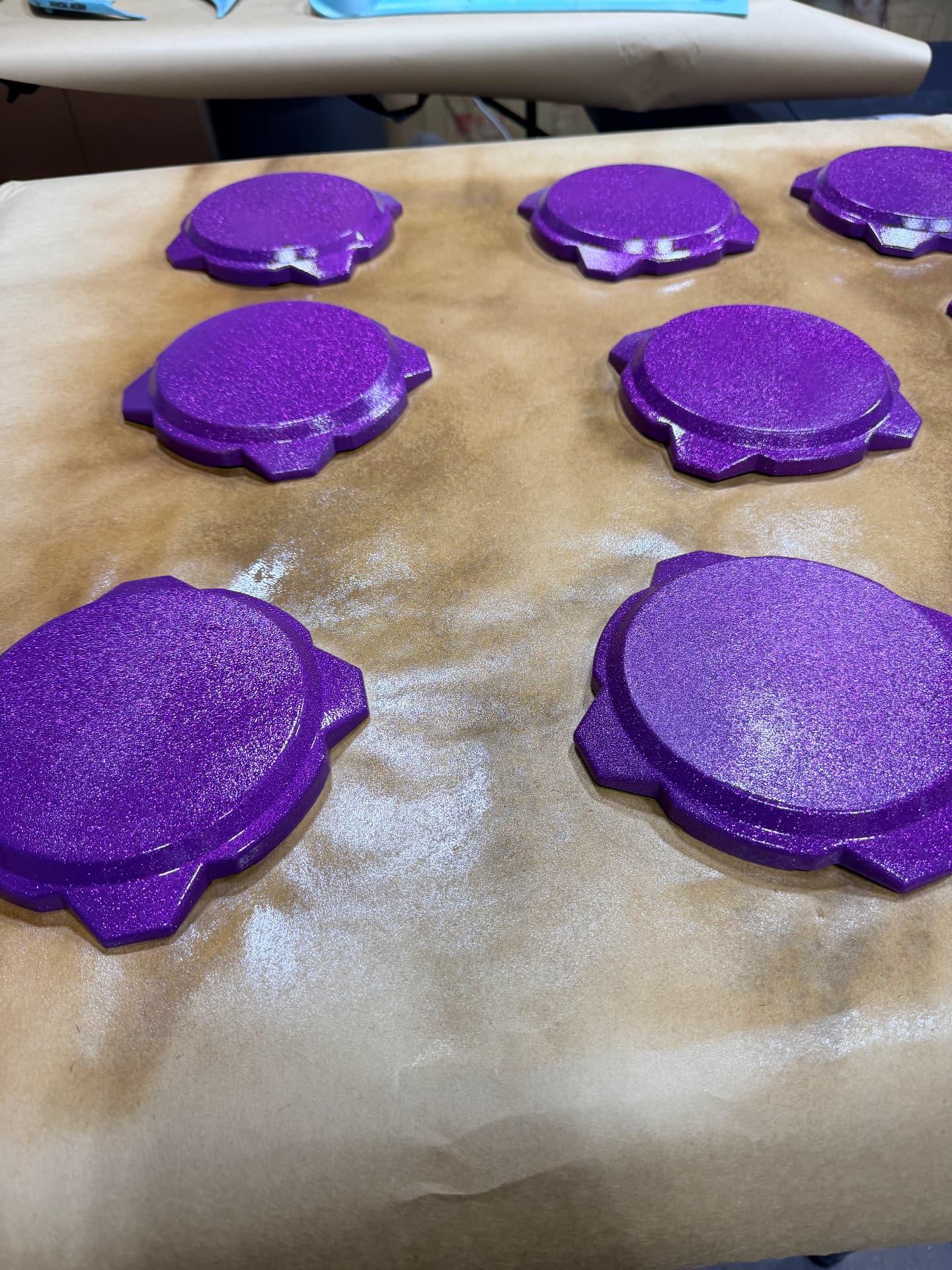 Fresh purple flake mirror caps curing on the bench