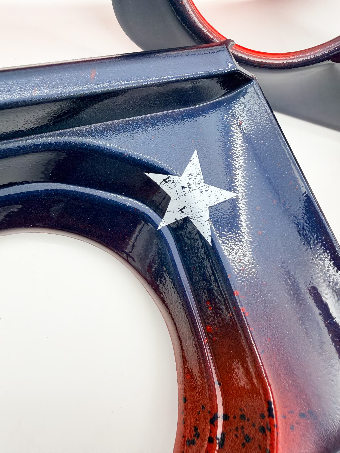 Distressed white star detail over the navy fade
