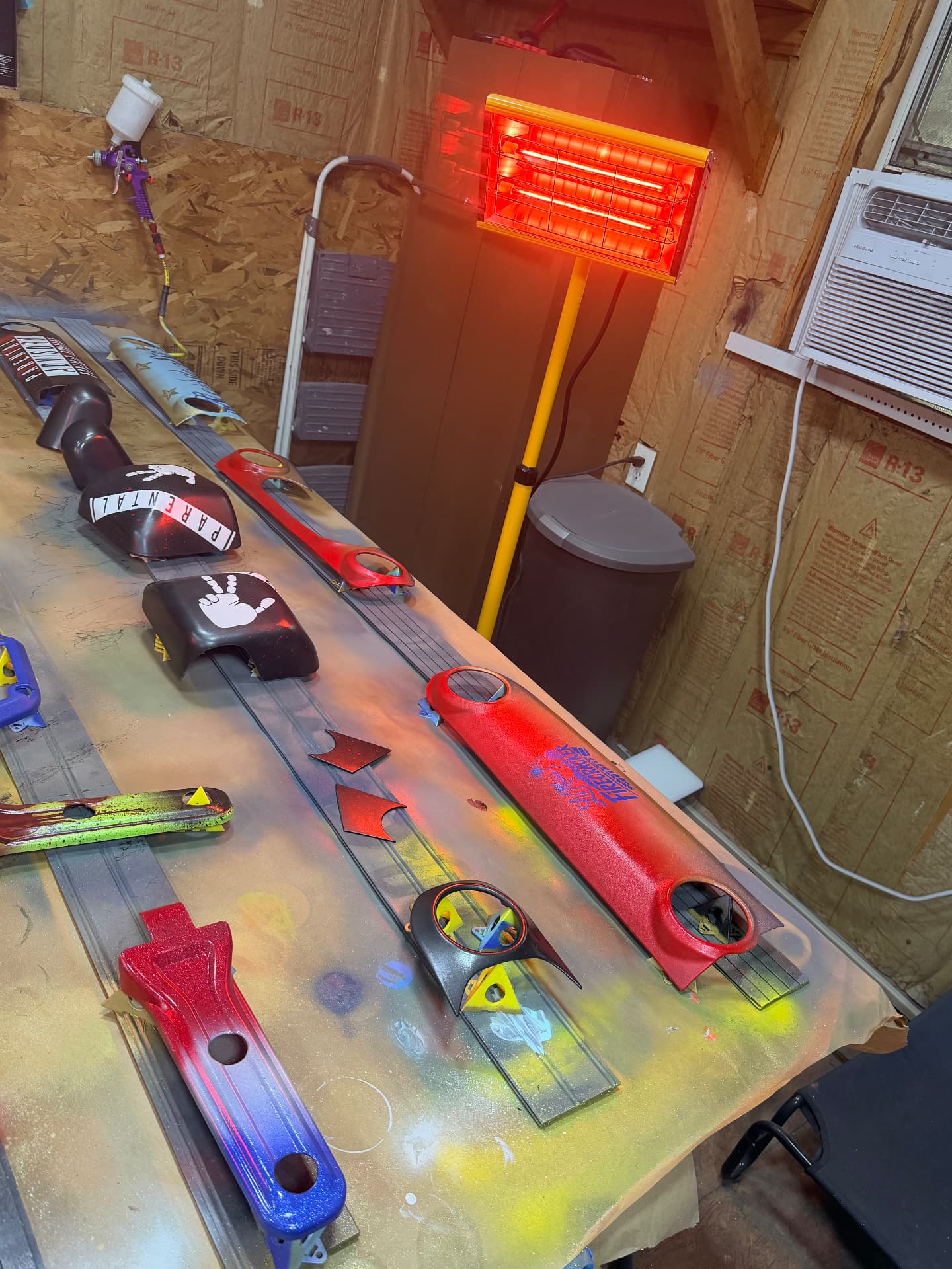 Trail Rebel paint booth with freshly painted Jeep trim laid out to cure