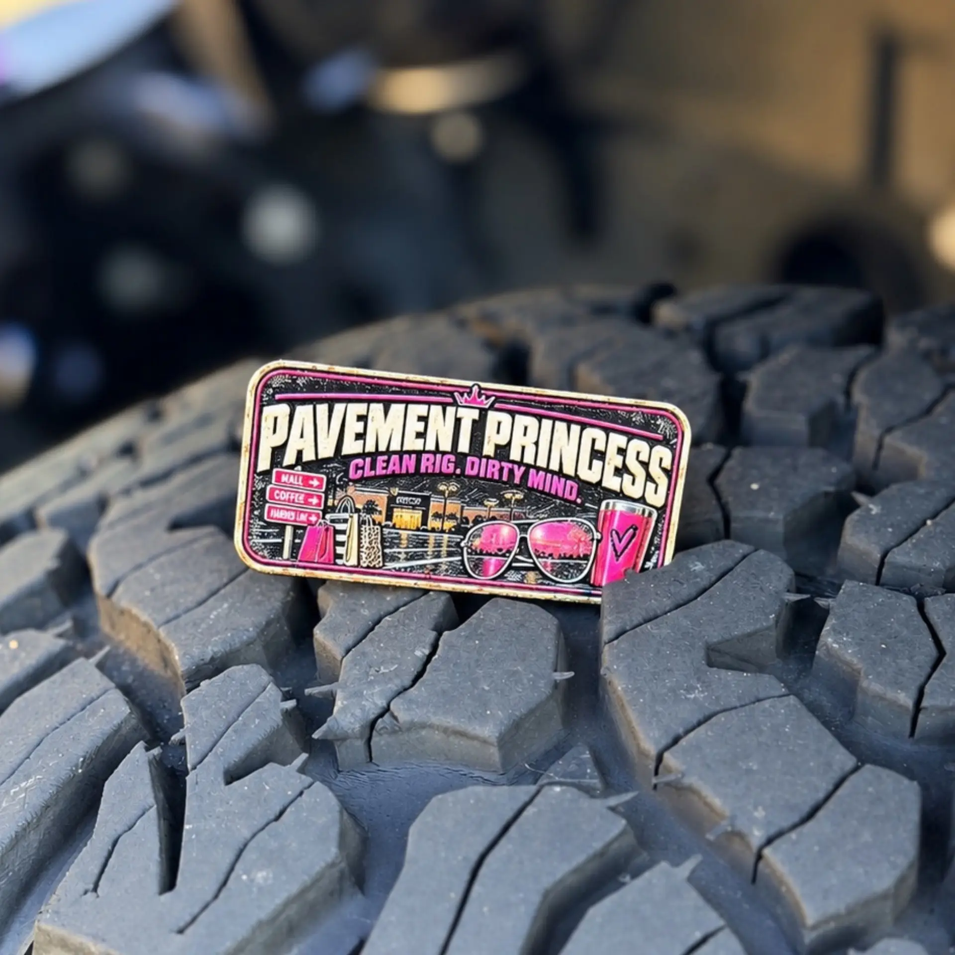 Pavement Princess trail badge photographed on a tire